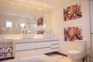 recently renovated bathroom with white bathroom fixtures and white interior