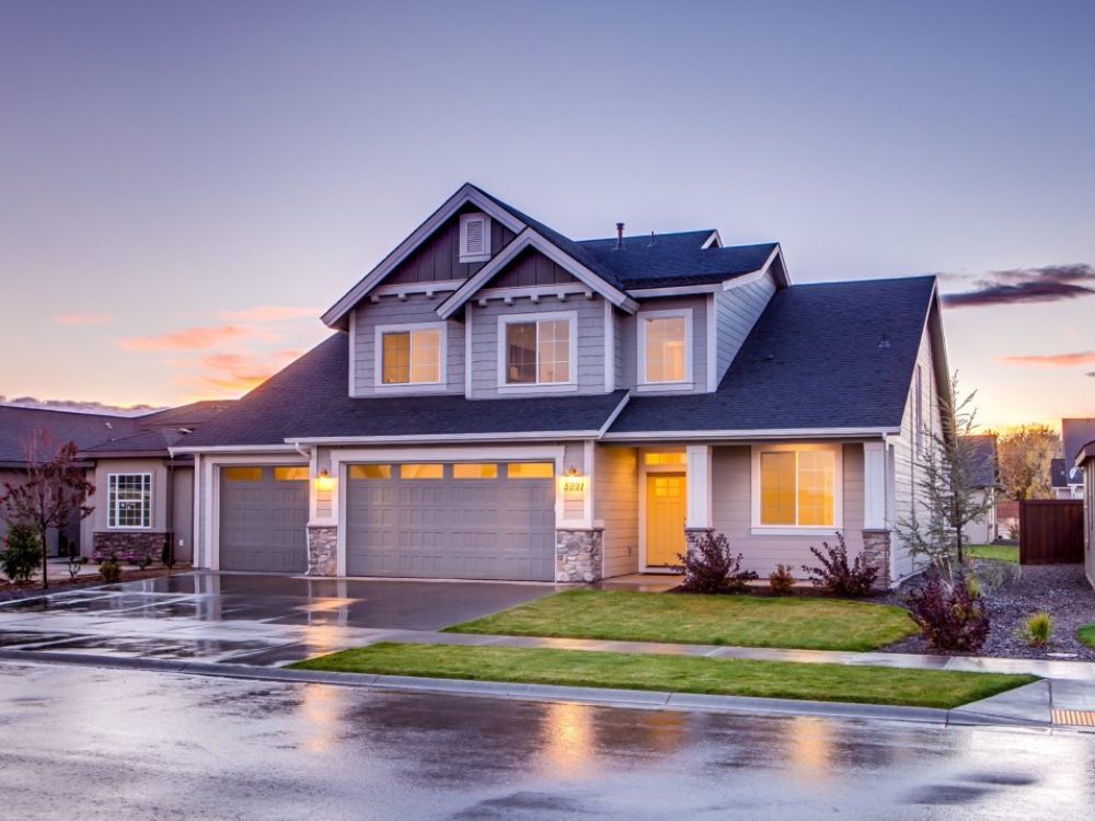beautiful home renovation with modern style and beautiful landscaping with fresh cut green grass