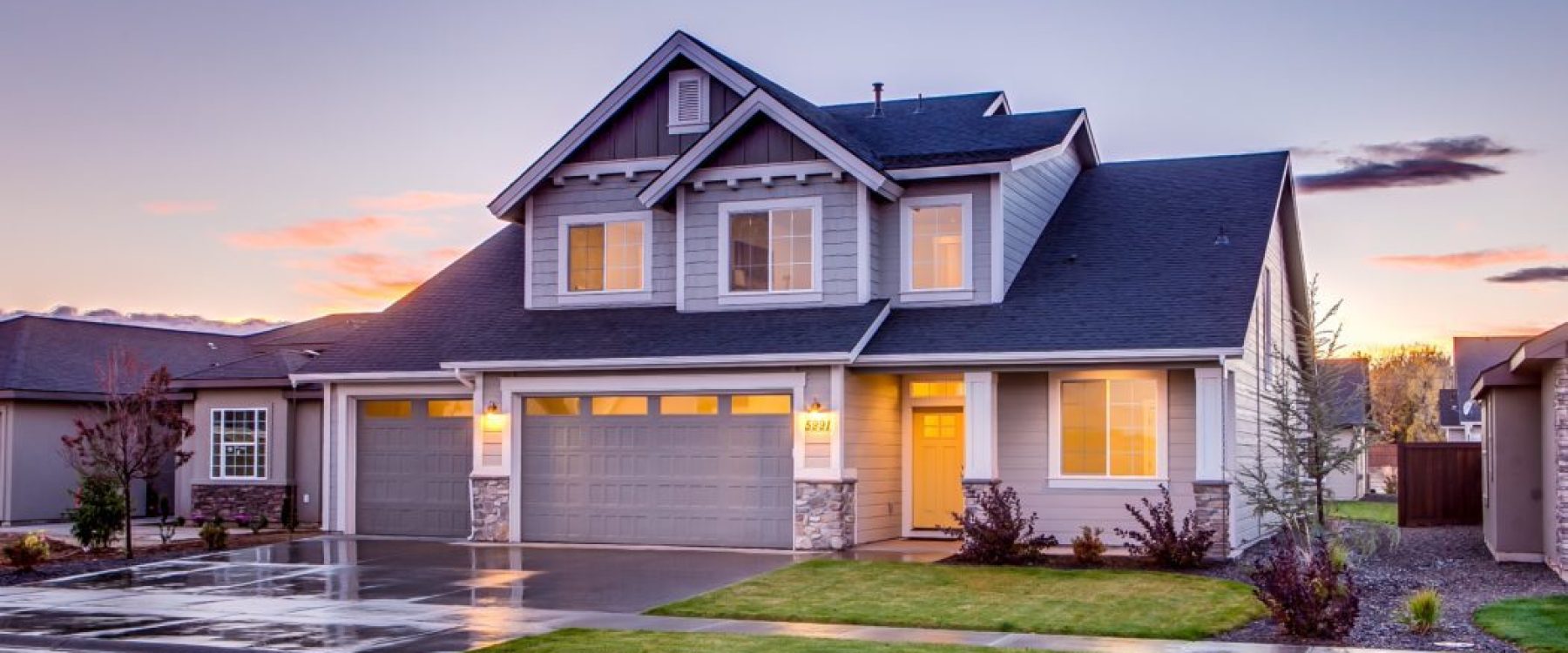 beautiful home renovation with modern style and beautiful landscaping with fresh cut green grass
