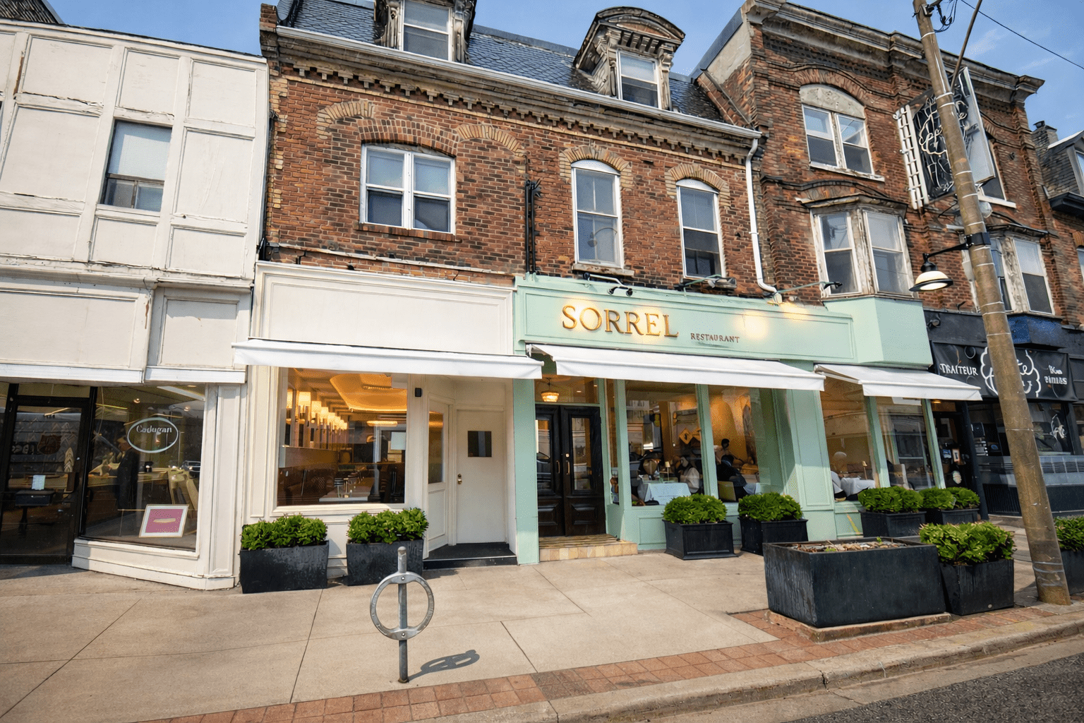 Completed restaurant construction project in Toronto featuring custom seating, wood finishes, lighting design, and full interior build-out by GTA General Contractors