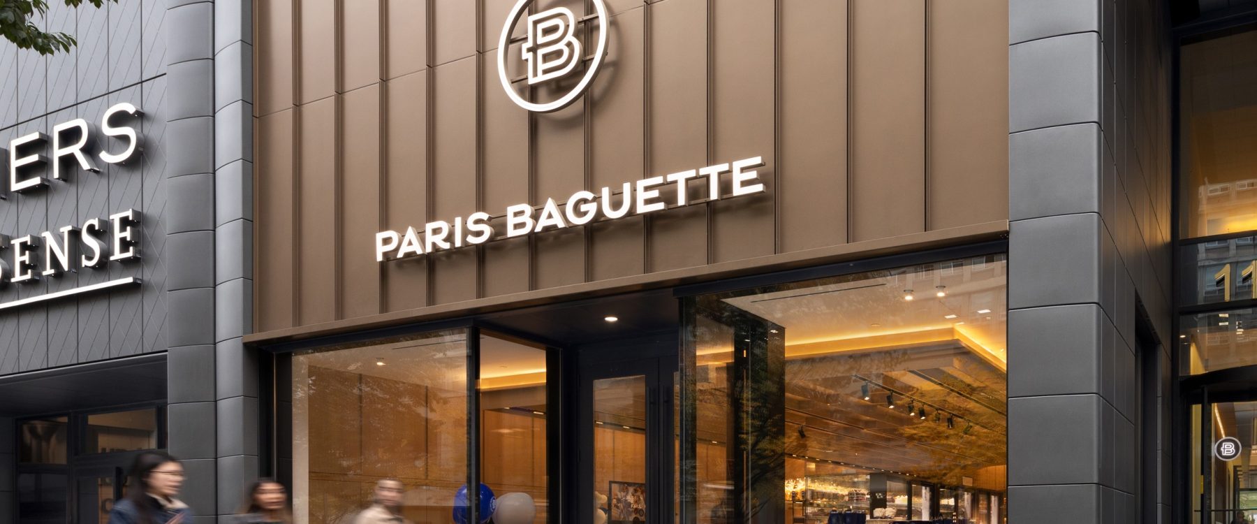 Exterior of a newly constructed Paris Baguette bakery in Toronto, with modern architectural façade