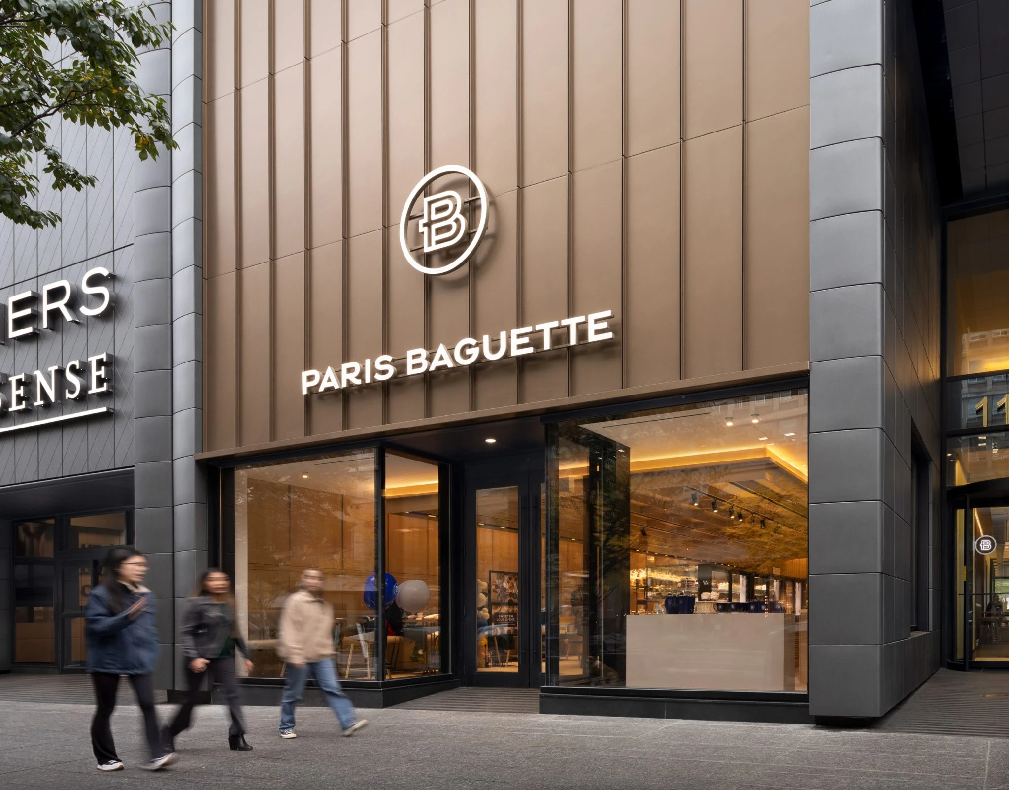 Exterior of a newly constructed Paris Baguette bakery in Toronto, with modern architectural façade