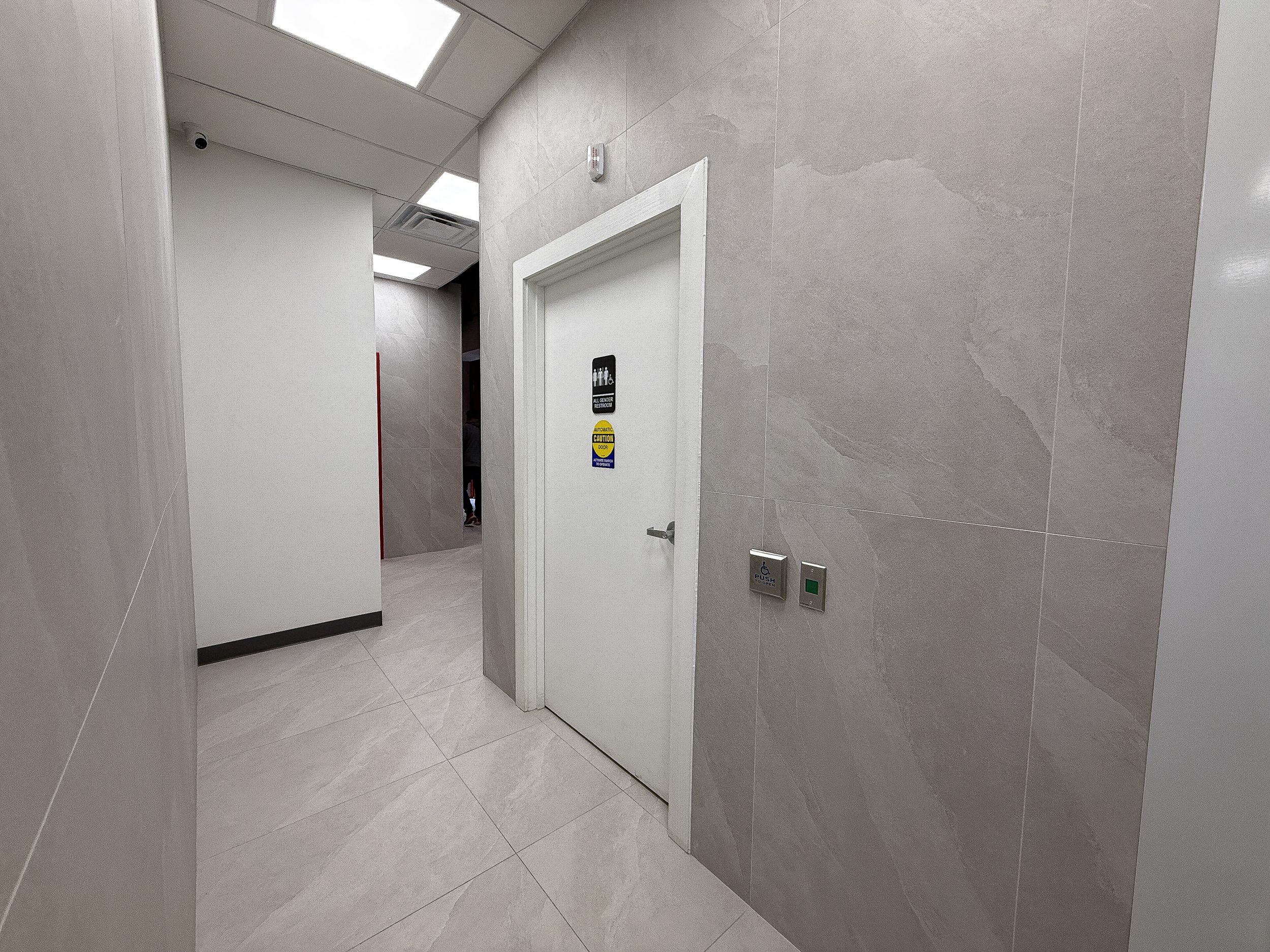 Completed design-build restaurant space for Bingz Burger Toronto featuring cohesive colour palette, polished surfaces, and modern dining environment.