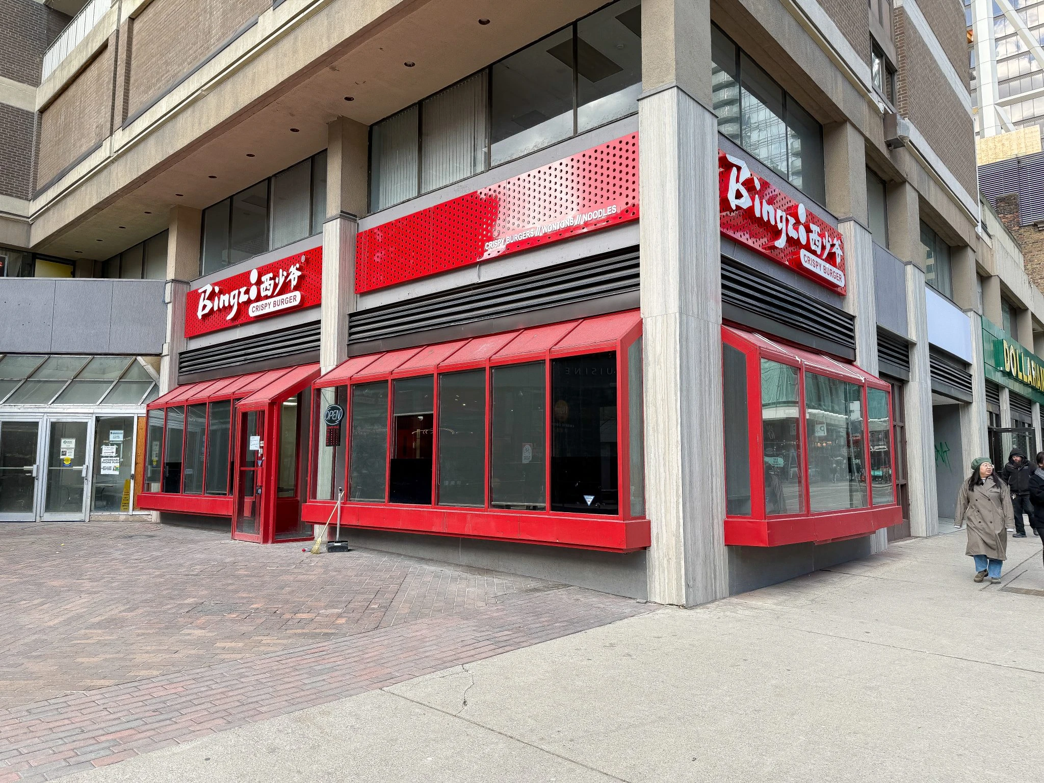 Completed restaurant design-build project showing Bingz Burger’s exterior storefront with bold red façade and modern branding.