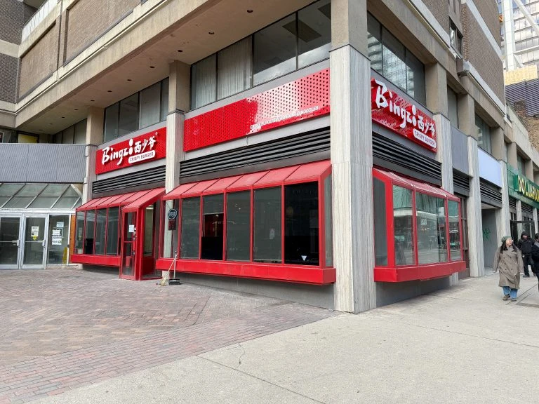 Completed restaurant design-build project showing Bingz Burger’s exterior storefront with bold red façade and modern branding.