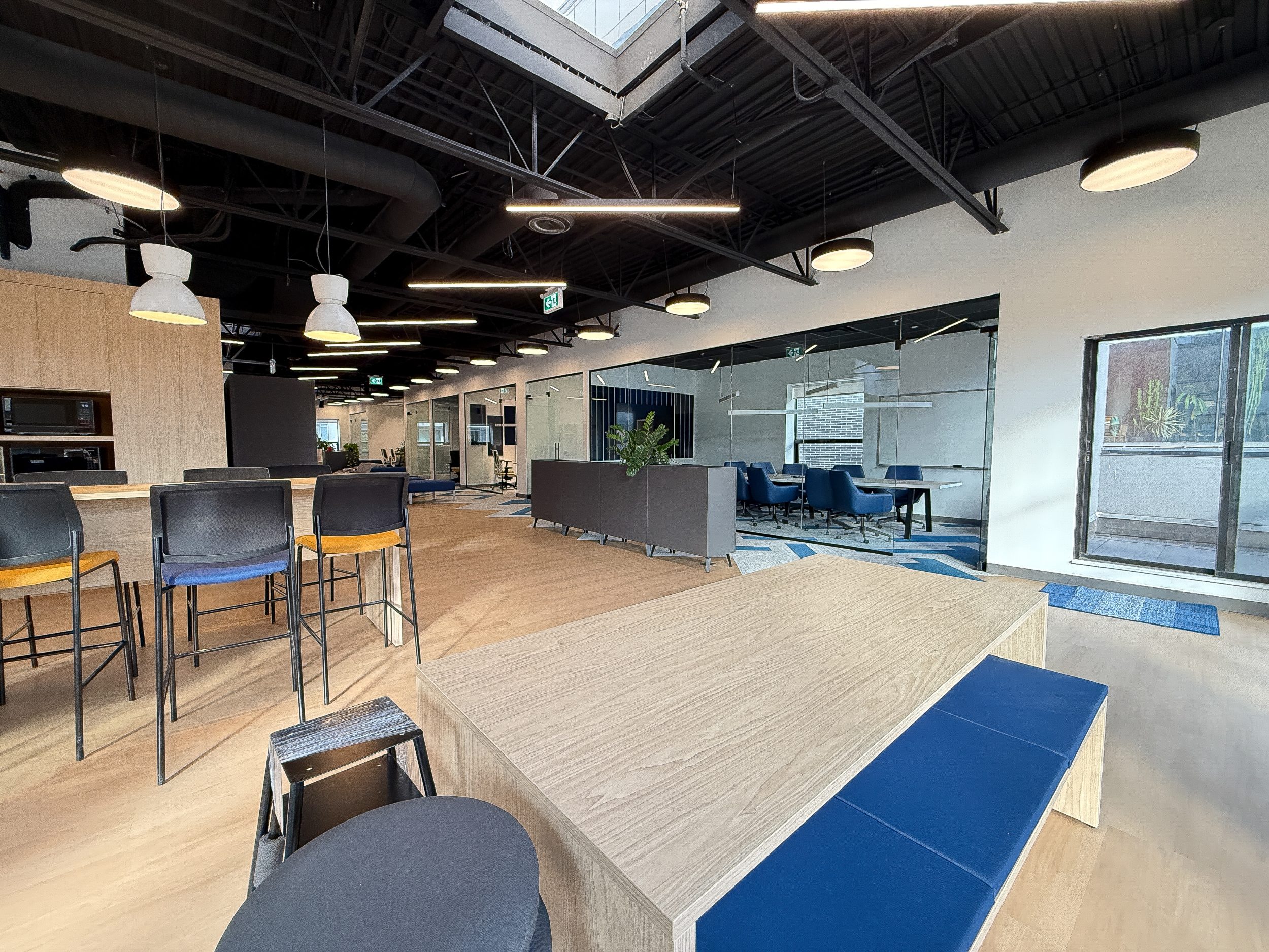 Commercial office construction project for Neoen with glass offices, collaborative work areas, and high-end Toronto interior build-out.