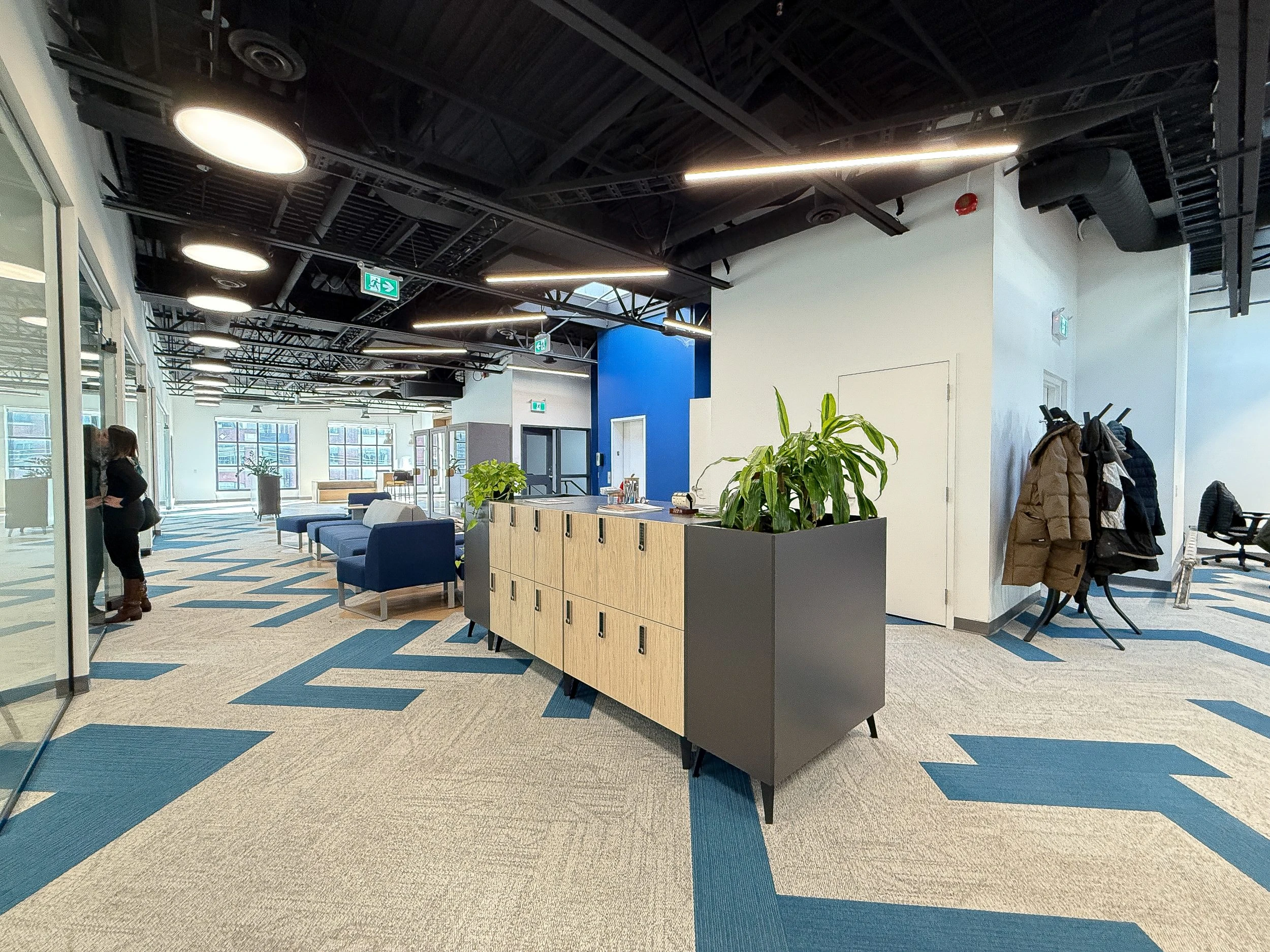 Open-concept Toronto office build for Neoen highlighting custom flooring patterns, ergonomic workstations, and commercial construction quality
