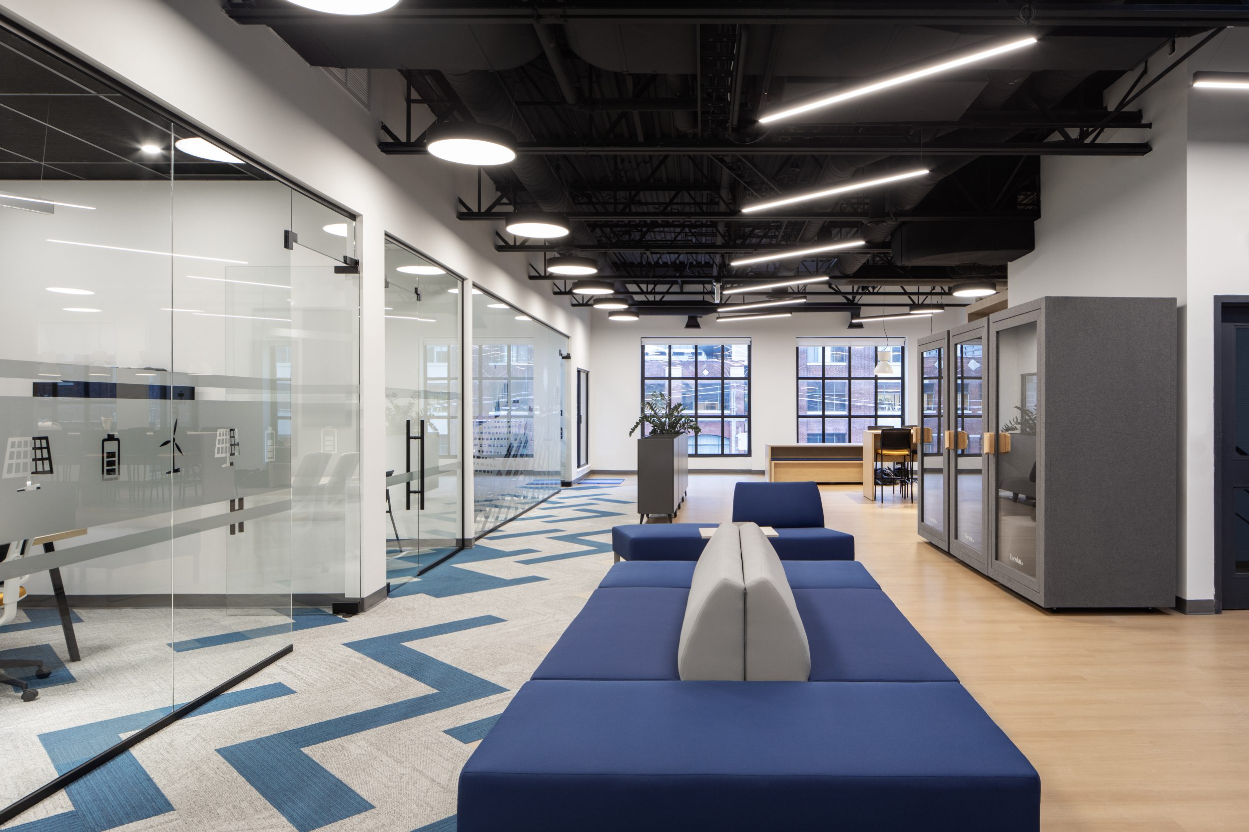 Neoen office construction project in Toronto by GTA General Contractors featuring modern corporate workspace, glass offices, open seating, and contemporary interior design
