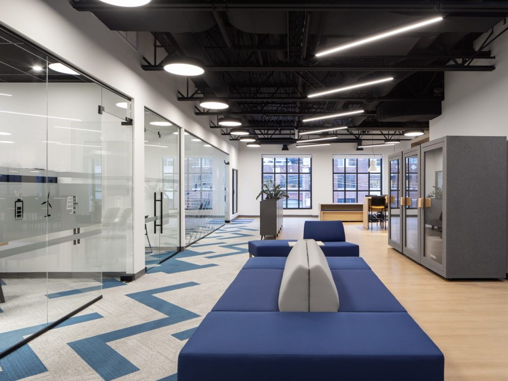 Neoen office construction project in Toronto by GTA General Contractors featuring modern corporate workspace, glass offices, open seating, and contemporary interior design