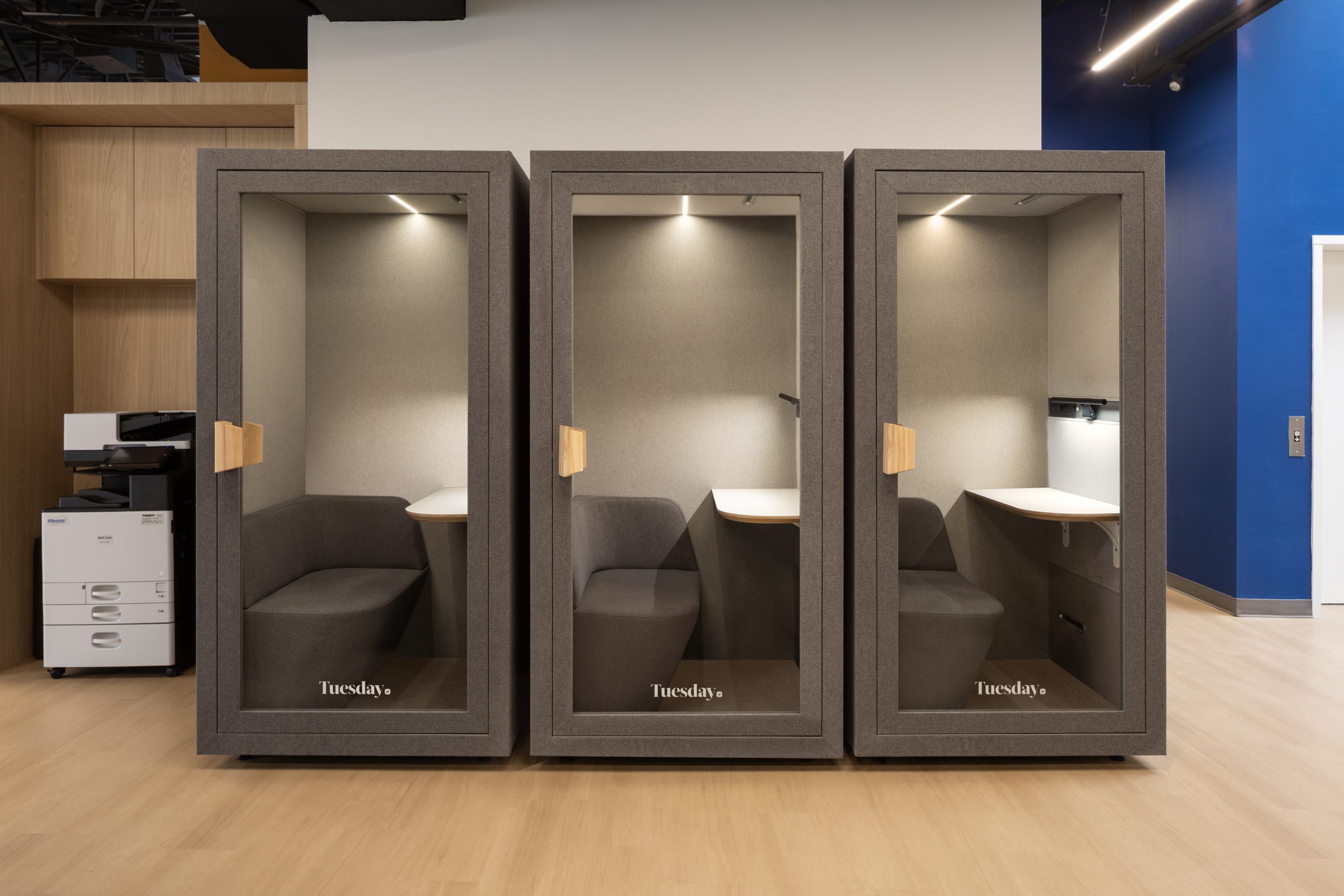 Neoen office construction featuring private acoustic work pods, modern office design, and flexible workspace solutions