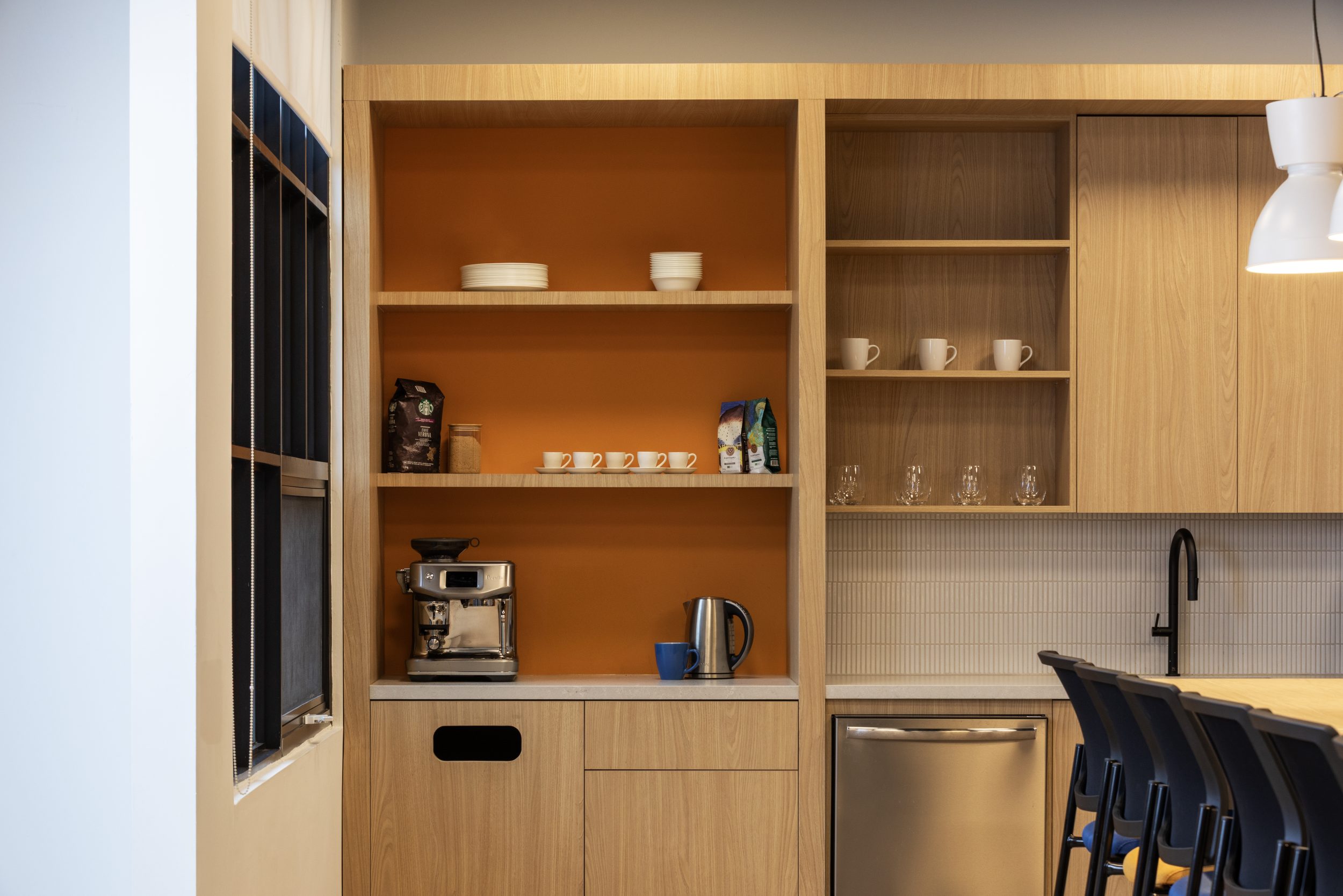 Neoen office kitchen construction Toronto featuring custom millwork cabinetry, coffee station, built-in shelving, and modern workplace amenities