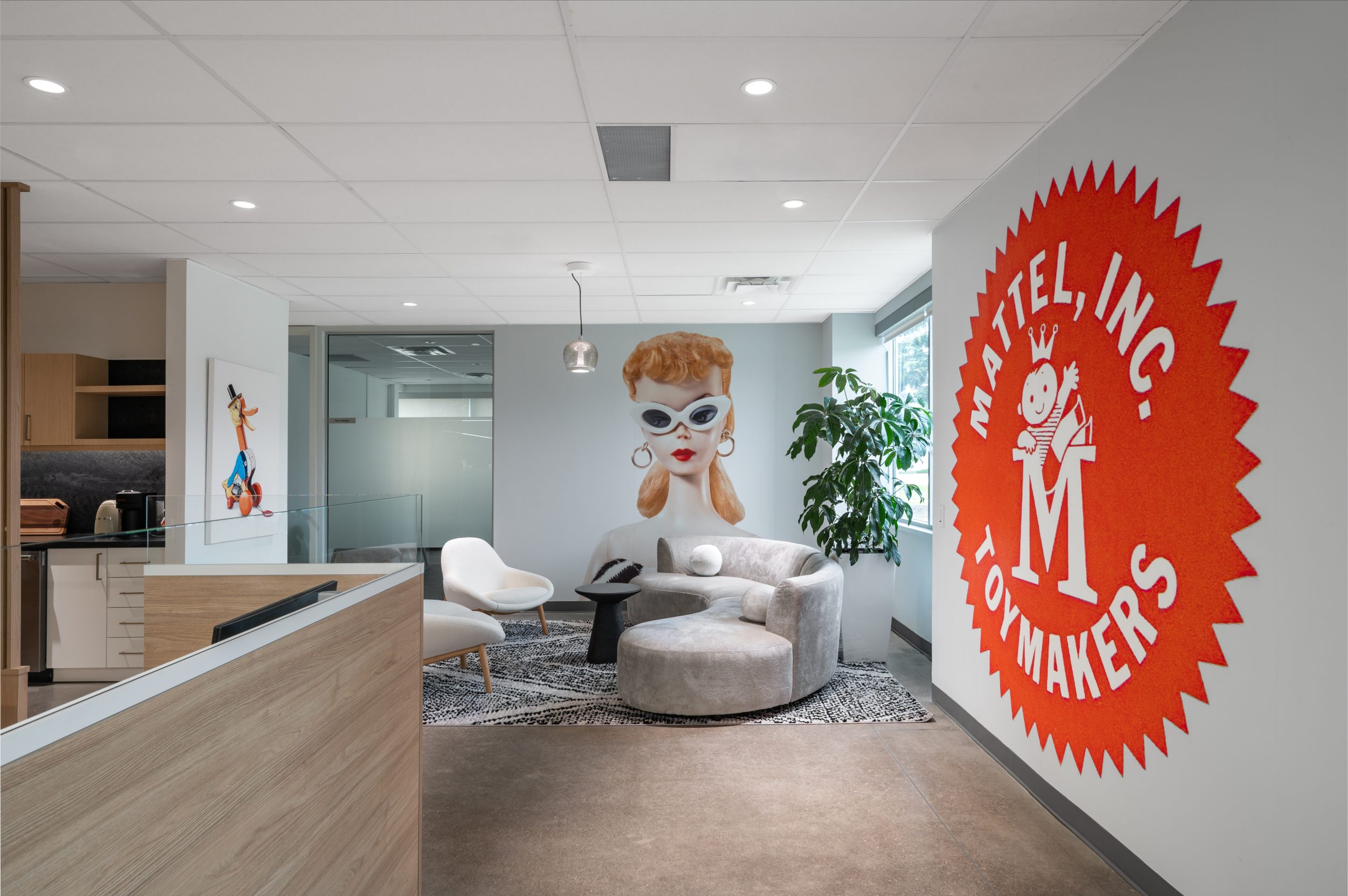 Modern executive workspace at Mattel Canada Headquarters in Mississauga, Ontario, showcasing custom millwork, collaborative meeting space, integrated technology, contemporary office furniture, commercial interior construction, and workplace modernization through a Design-Build renovation.